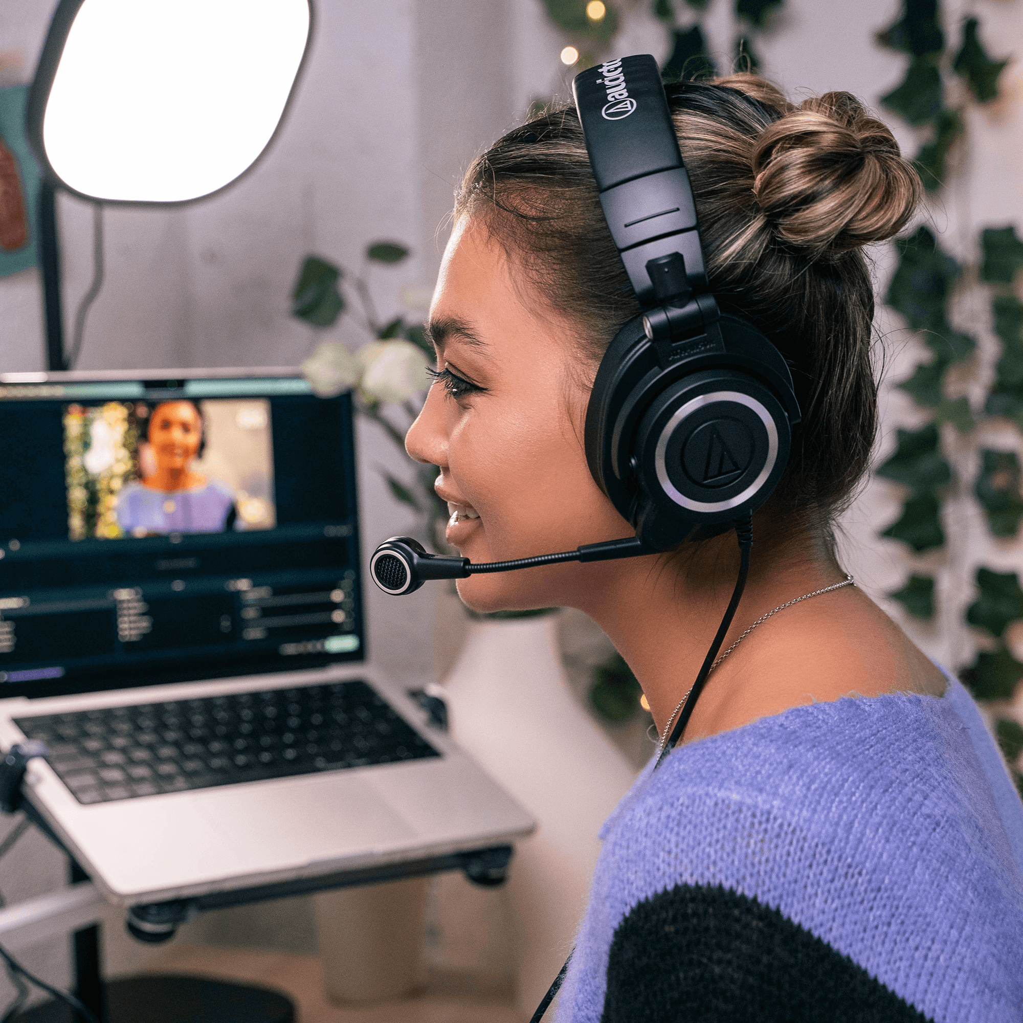 woman using ATH-M50x StreamSet while livestraeming